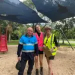 Inspectors pointing at shade sail