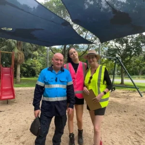 Inspectors pointing at shade sail