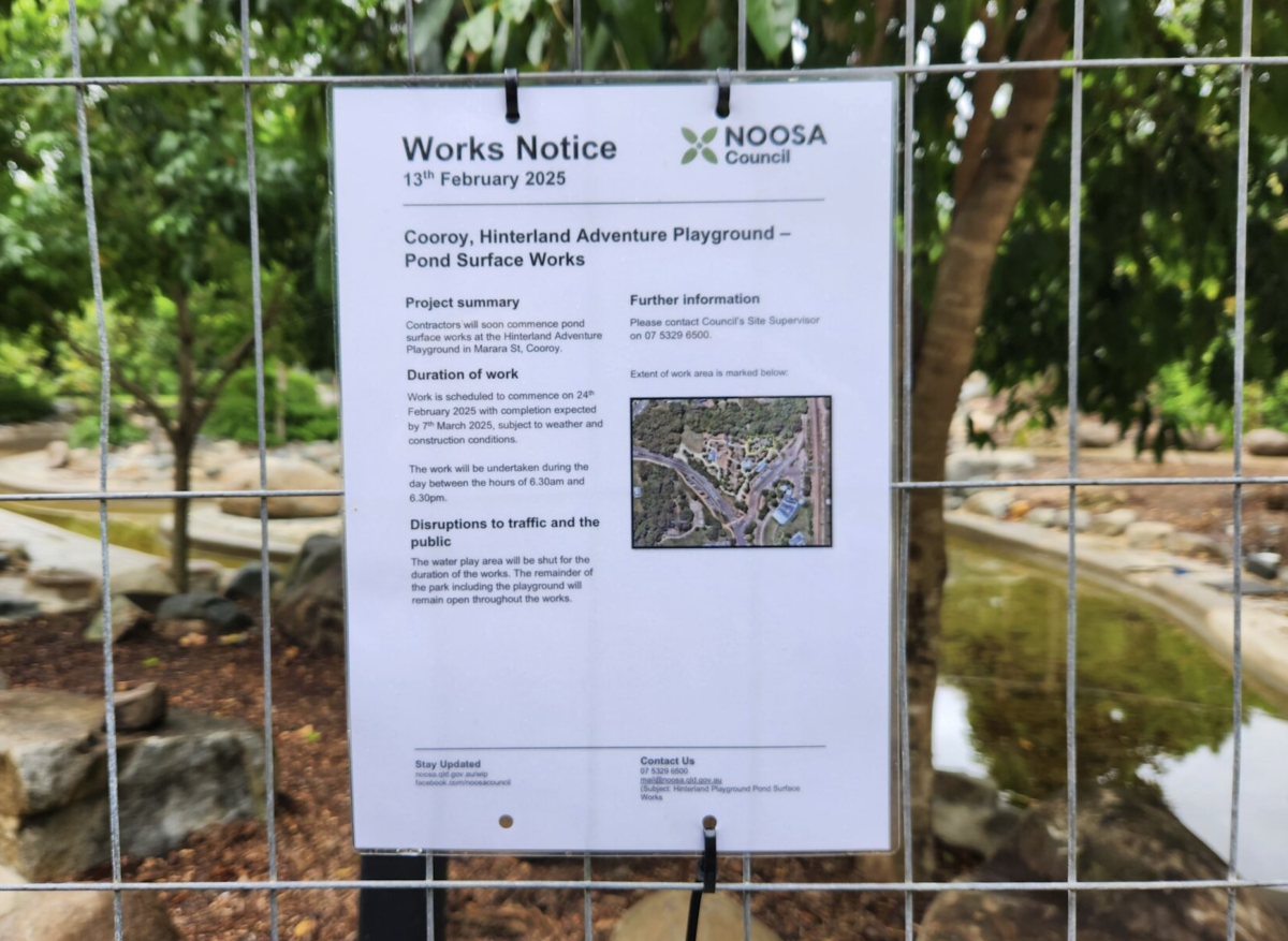 Playground Splash Area Closed After Child Suffers Foot Injury Works notice sign attached to fencing at Hinterland Adventure Playground in Cooroy, QLD, outlining pond surface works and partial playground closure from February 24th - March 7.