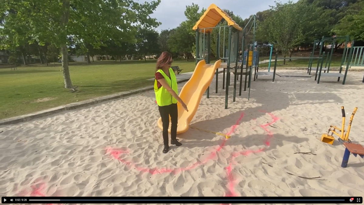 Playground worker with safety vest